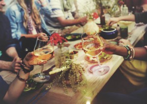 People toasting wine glasses
